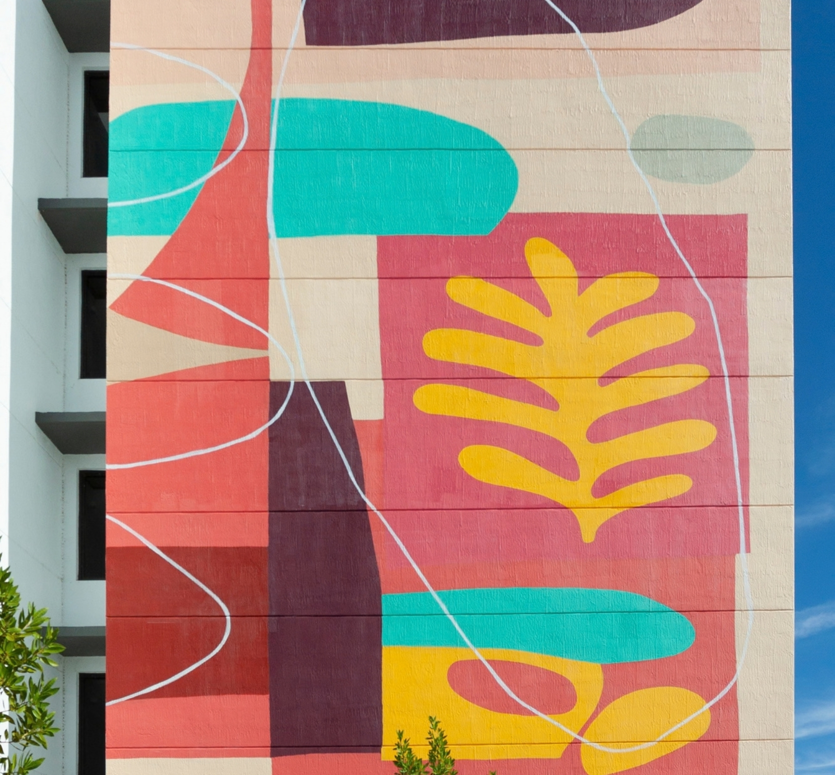 Close-up of colorful mural artwork on the exterior of Old Cutler Village Phase 2